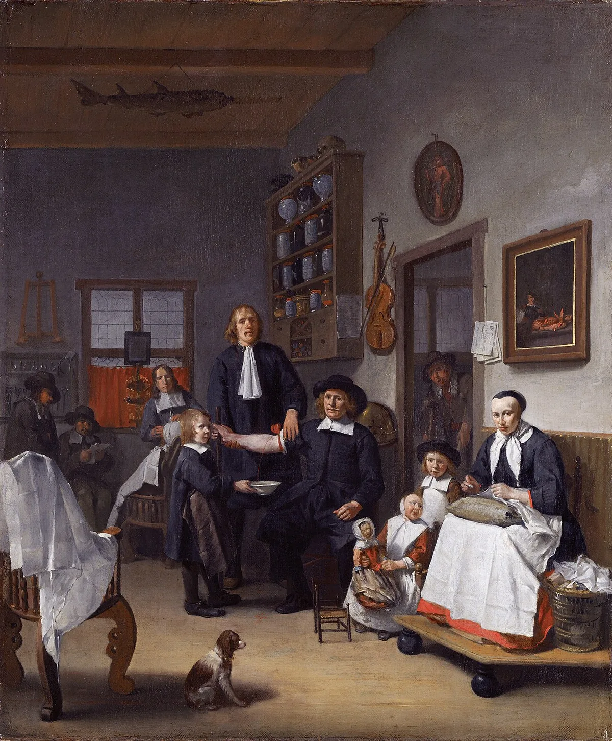 A seventeenth-century barber-surgeon workshop with people receiving treatment